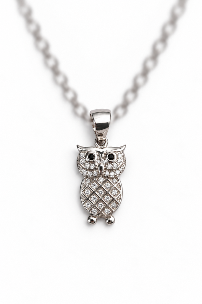 925 sterling silver owl pendant with sparkling stones and black eyes.