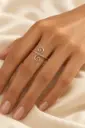 An open ring with a flowing design and two opposing spiral details.