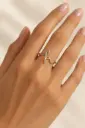 An open silver ring with a sleek, sculptural design