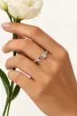An open ring featuring a crescent moon, a star